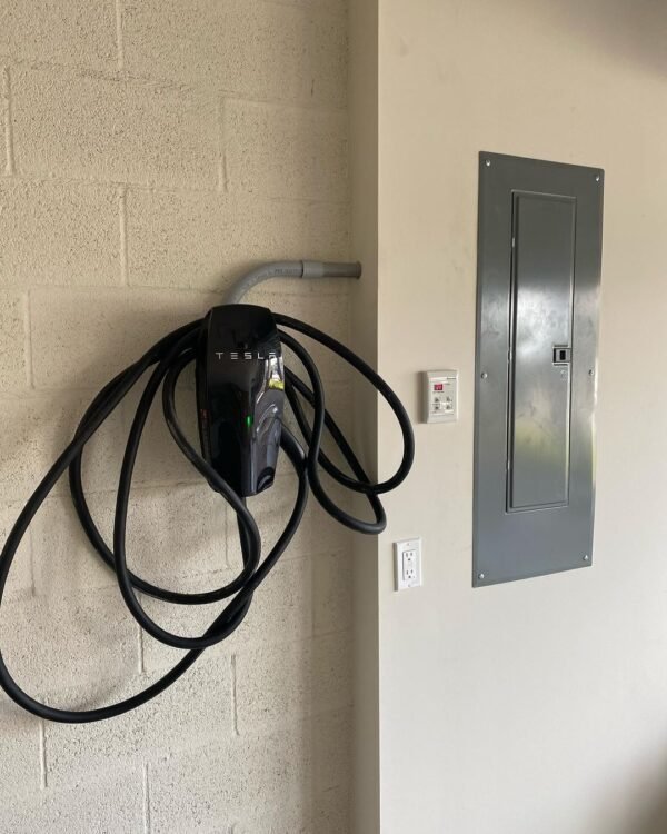 Tesla wall charger installed in a garage